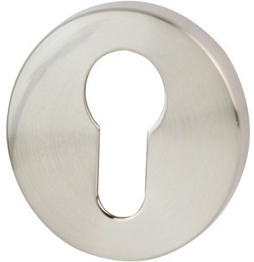 Metalowy wkład zamka w kształcie okręgu z otworem w kształcie klucza.