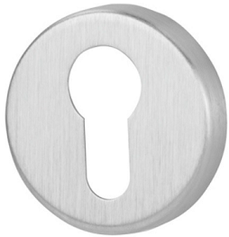 Metalowy wkład zamka w kształcie okręgu z otworem w kształcie klucza.