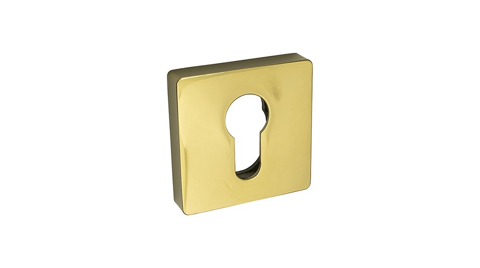 Złota osłona zamka w kształcie kwadratu z otworem na klucz.