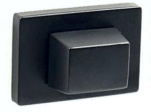 Czarny przycisk na prostokątnej podstawie, umieszczony na jasnym tle.