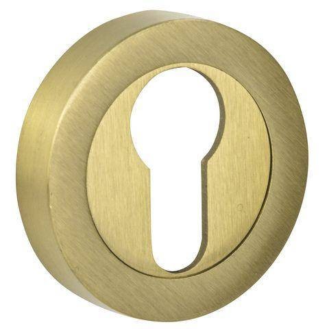 Złota wkładka zamka w kształcie okręgu z otworem na klucz.
