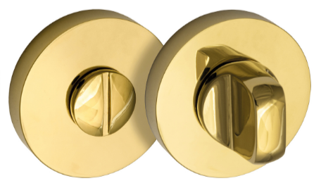 Złoty zamek drzwiowy z okrągłymi elementami i pokrętłem do zamykania.