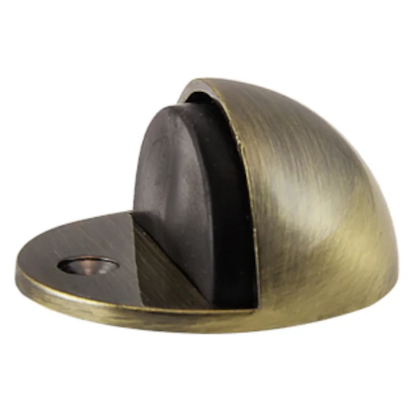 Metalowy stoper do drzwi w kolorze mosiądzu z czarną gumową częścią.