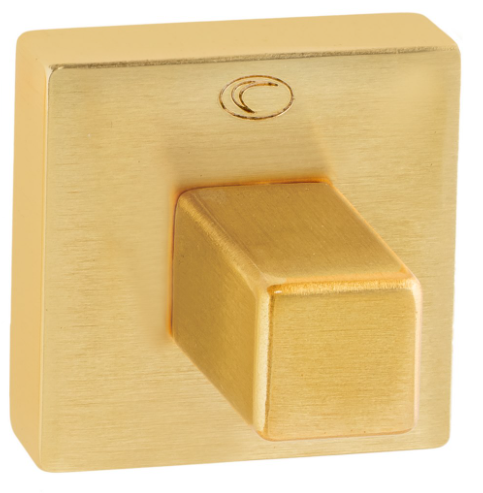 Złoty włącznik światła o kwadratowym kształcie z wypukłym przyciskiem.