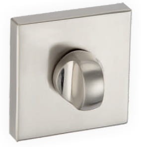 Metalowy włącznik z okrągłym pokrętłem na kwadratowej podstawie.