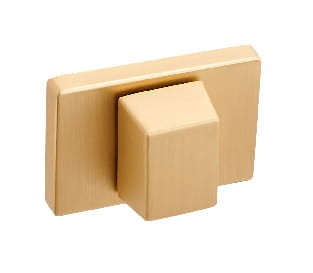 Złoty, prostokątny włącznik światła z kwadratowym przyciskiem.