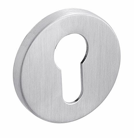 Metalowy wkład zamka w kształcie okręgu z otworem w kształcie klucza.