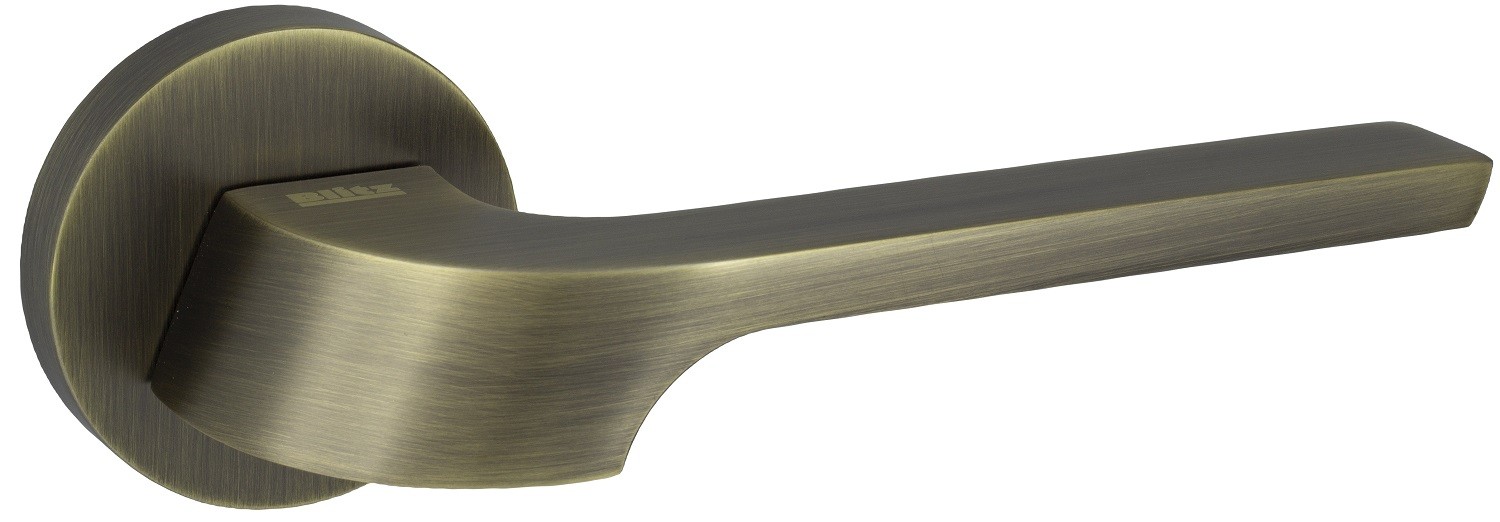 Złoty uchwyt drzwiowy o nowoczesnym designie, z gładką powierzchnią i okrągłą podstawą.