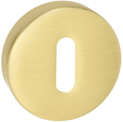 Złoty, okrągły element z wycięciem w kształcie litery "O".