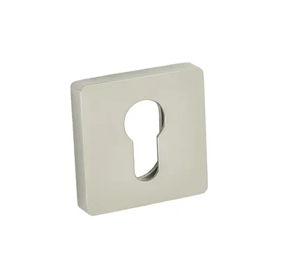 Metalowy wkład do zamka w kształcie prostokąta z otworem w kształcie klucza.