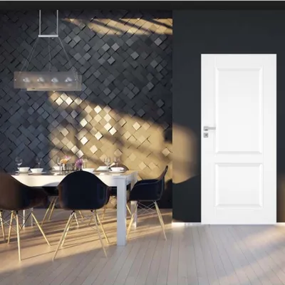 Nowoczesna jadalnia z białym stołem, czarnymi krzesłami i dekoracyjną ścianą w odcieniach szarości.